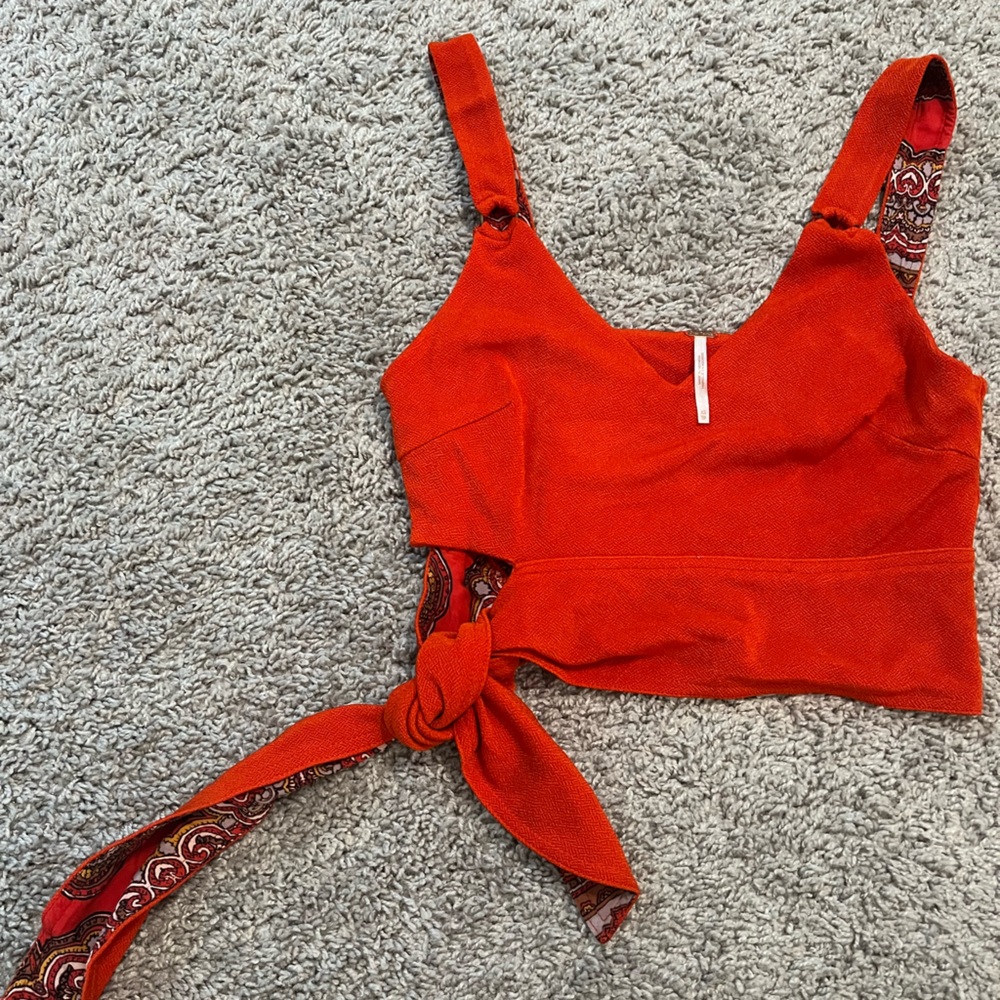 Free people size xs red top with pattern inside